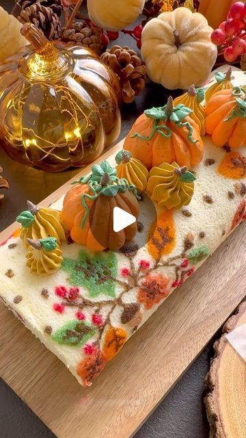 Winnie Wai-Ling Lee on Instagram: "Autumn Cake Roll 🍂🍂🍂 . . It’s been a while since I made a new cake roll design and instead of the usual all over pattern I went for a placement print. It rolled up beautifully and the cake roll had to be topped with pumpkins 🎃🎃🎃 would love to know if you want to see more cake roll designs ??? . . Would you like to make this gorgeous autumnal cake roll? This cake roll recipe can be found on my blog. Link in bio. . . Alternatively you can COMMENT - ‘cakeroll’ i will dm you the recipe link.  . . #cakeroll #autumnvibes #autumn #homemade #cakeideas #cake #cakedecorating #swissroll #treats #recipe #tutorial #love #food #bakingvideo #bakers #foodlover #easydessert  #tasty #dessert #video #inspiration #instagood #reels #reelsinstagram" Thanksgiving Pumpkin Roll, Cake Roll Design, Autumnal Cake, Decorated Cake Roll, Frosting Decorating Ideas, Cake Frosting Decorating, Autumn Cake, Pumpkin Rolls Recipe, Thanksgiving Cakes