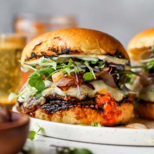 Portobello Romesco Burgers - Dishing Out Health Portobello Burger Recipe, Grilled Portobello Mushroom Burger, Portobello Burgers, Dishing Out Health, Portobello Mushroom Burger, Portobello Burger, Cauliflower Hummus, Meatless Burgers, Balsamic Marinade