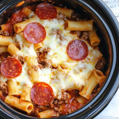 This easy Crockpot pizza casserole will quickly become a new favorite! With pasta, pepperoni, and plenty of cheese, it's tough to resist! Pasta Crockpot Meals, Pasta Crock Pot Recipes, Crock Pot Pasta Recipes, Pizza Casserole Crockpot, Pasta In The Crockpot, Pasta Crockpot Recipes, Crockpot Pizza Casserole, Pasta Pepperoni, Crockpot Pizza