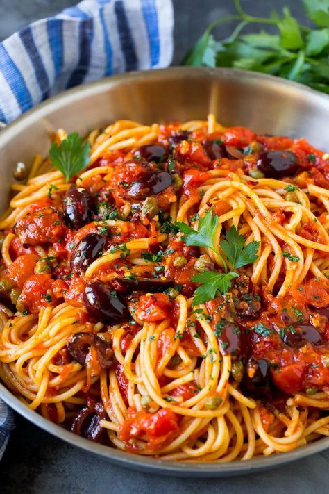 Pasta Puttanesca Recipe #pasta #tomatoes #olives #italianfood #dinner #dinneratthezoo Puttanesca Pasta, Pasta Puttanesca Recipe, Puttanesca Recipe, Spaghetti Alla Puttanesca, Puttanesca Sauce, Alla Puttanesca, Tuna Recipe, Traditional Pasta, Pasta Puttanesca