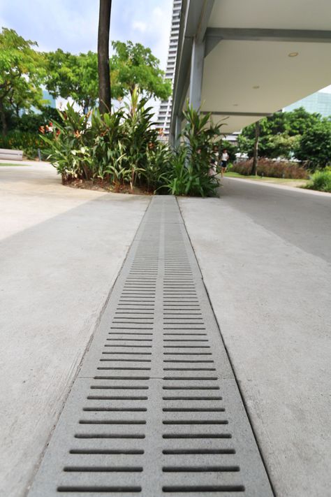 Water Draining Landscape, Drainage Grates Design, Driveway Drain, Shower Grate Drain, Drainage Grates, Sustainable Architecture Design, Gardens By The Bay Singapore, Backyard Drainage, Pavement Design