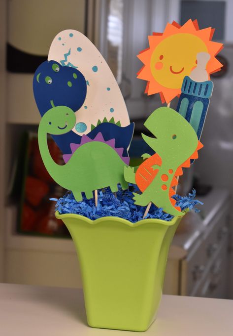 Dinosaur baby shower center piece made with cricut machine Baby Dinosaur Party, Dinosaur Baby Shower Theme, Dinosaur Birthday Theme, Dinosaur Themed Birthday Party, Dino Birthday Party, Dinosaur First Birthday, 1st Birthday Themes, Dinosaur Theme Party, Dinosaur Baby Shower