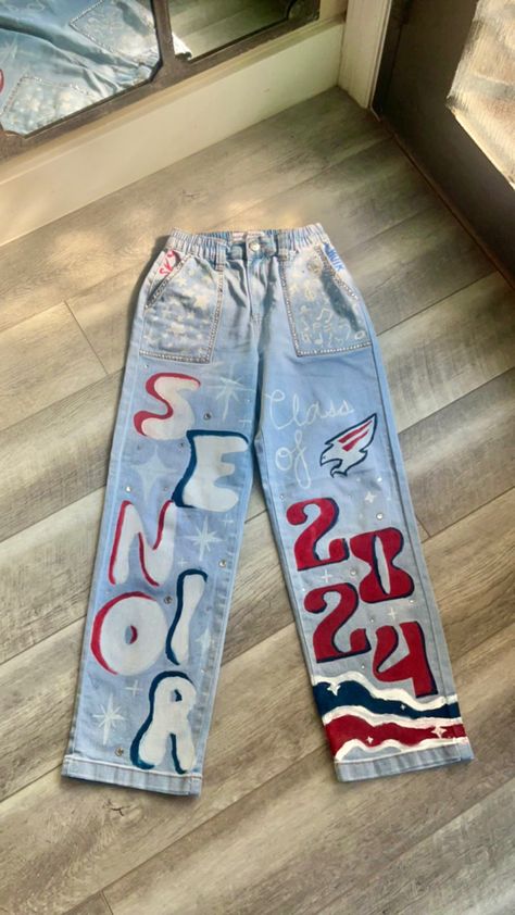 Sr Painted Jeans, Hoco School Spirit Day, Spirit Week Painted Jeans, Football Game Leg Paint Ideas, Jeans For Senior Year, Western Senior Overalls, Decorated Senior Jeans, Class Of 2024 Jean Ideas, Grad Coveralls Ideas