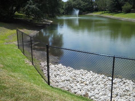 White Fence Company installed this 5' tall black chain link fence around a beautiful fountain pond. Fence Around Pond Ideas, Black Chain Link Fence, Fence Around Pool, White Fence, Fencing Companies, Cabin Exterior, Chain Link Fence, Natural Pool, Garden Fence