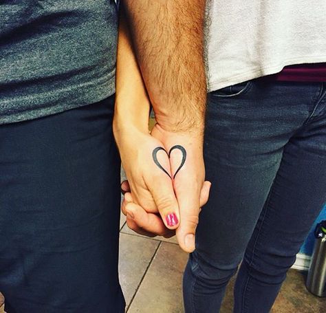 Half Heart Couple Tattoo, Matching Heart Tattoos Couple, Couple Tattoos That Connect, Half Heart Tattoo Couples, Heart Tattoo For Couples, Couples Heart Tattoos, Holding Hands Tattoo Couple, Couple Heart Tattoo, Small Tattoos For Couples Marriage