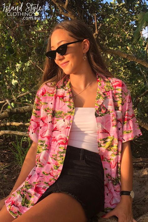 WOMENS CUT RAYON HAWAIIAN SHIRT - Can be easily paired with your favourite wardrobe staples. Perfect for a music festival, beach party, Aloha Friday or casual wear. Features and open neck collar, coconut buttons, short sleeves with a turned-up cuff with button detail. Matching items for the whole family available! #hawaiianshirt #partyshirt #alohashirt #festivalshirt #uniforms #alohafriday #pinkflamingo #flamingoclothing #ladieshawaiianshirt #party #hawaiianthemed #flamingoshirt #womens #shirt Tropical Shirts Women, Hawaiian Festival Outfit, Modern Hawaiian Outfit, Aloha Shirt Outfit Women, Hawaiian Shirts For Women, Aloha Outfit Ideas For Women, Hawian Shirt Outfits, Tropical Shirt Outfit Women, Hawaiian Outfit Women Party Hawaii