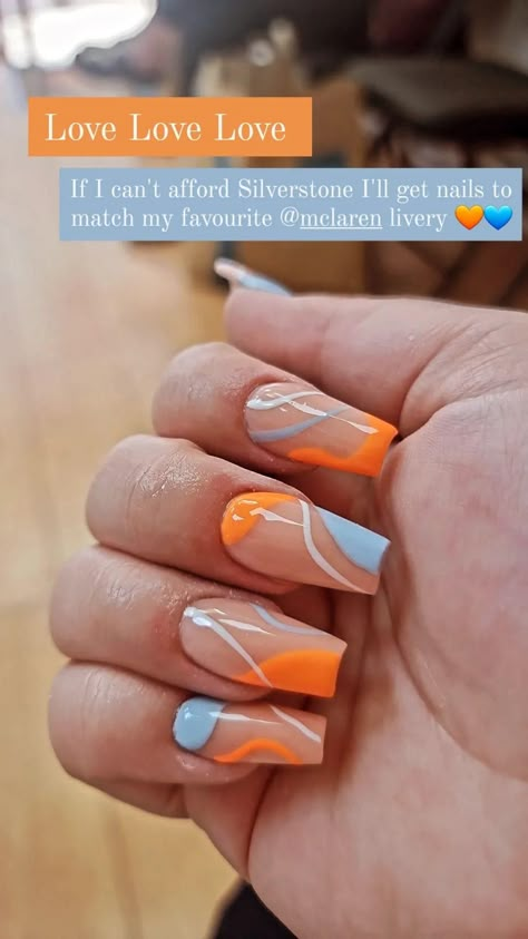 Fave mclaren livery = stunning nails 💙🧡 Construction Nails Designs, Spring Nails 2023 Orange, Blippi Nails, Orange And White Acrylic Nails Designs, F1 Nail Ideas, Cute Orange And White Nails, F1 Acrylic Nails, Race Inspired Nails, Lando Norris Inspired Nails