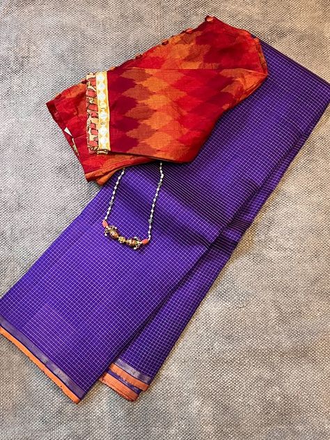 Charita Violet checked kanchipuram silk saree is a pure handwoven kanchipuram silk saree with thread woven orange checks on the body and a peach shot colour pallu with zari lines . The blouse piece is also the same shot colour like the pallu, a violet and orange. The barkha orange blouse with kutch embroidery is the perfect blouse as it provides a break from the violet in the body. This can also be worn for simple occasions, poojas and temple visits. To view similar sarees, pls click on https://aavaranaa.com/kanchipuram-silk-sarees/ Pearl Blouse, Kutch Embroidery, Blouses Designs, Indian Saree Blouse, Indian Saree Blouses Designs, Perfect Blouse, Indian Fashion Saree, Saree Blouses, Trendy Sarees