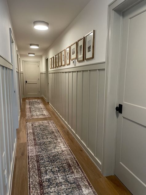 Wainscoting Small Hallway, Hallway With Doors Aesthetic, Hallway Decorating Ideas Modern, Hallway Ideas Board And Batten, Hallway With Bedroom Doors, Board And Batten Hallway Color Ideas, Hallways Paint Ideas, Accent Wall Long Hallway, Dark Board And Batten Hallway