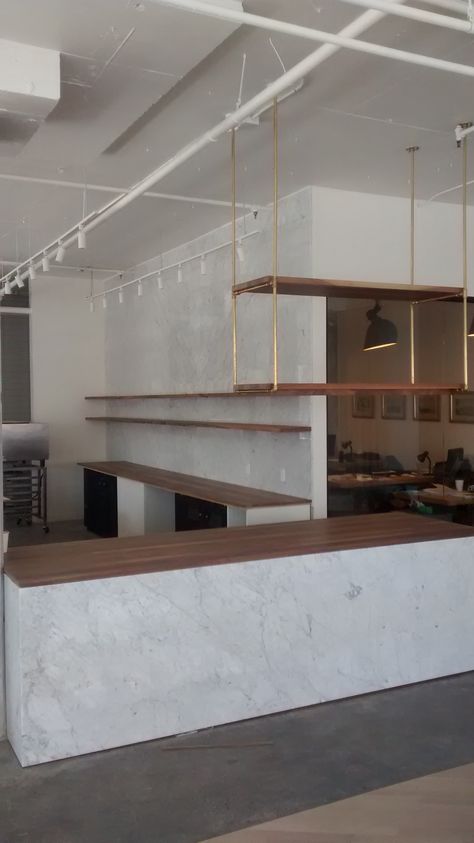 Floating shelves in the background, shelves suspended on brass and a counter top. All made from solid walnut for soupesoupe at 5333 casgrain.  atelierassembly.com Suspended Shelves, Brass Shelving, Floating Kitchen Shelves, Cantilever Shelf, Metal Floating Shelves, Bar Outdoor, Walnut Shelves, Dropped Ceiling, Ceiling Hanging