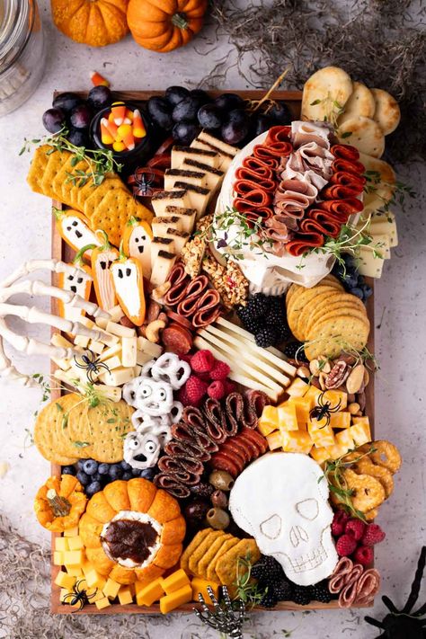 The best Halloween charcuterie board with ideas for skeleton pretzels, ghost peppers, candy corn buckets, and skull cheese! Tons of ideas that work for kids, teens, and even adults! Perfect for your next Halloween meal or snack! Skeleton Pretzels, Skeleton Charcuterie Board, Halloween Cheese Board, Halloween Charcuterie Board Ideas, Kid Holiday Games, Disney Party Games, Halloween Meal, Halloween Charcuterie Board, Charcuterie Appetizers