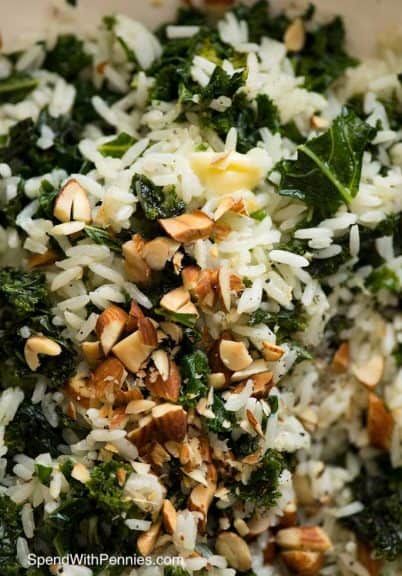 Garlic Butter Kale Rice closeup with almond garnish Kale And Rice, Kale Rice, Bacon Kale, Rice Side Dishes, Spend With Pennies, Kale Recipes, Veggie Side Dishes, Pasta Rice, Side Recipes