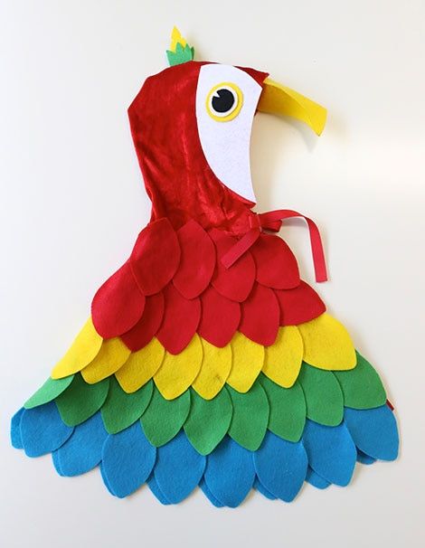 Easy No-Sew DIY Parrot Costume | Play | CBC Parents Baby Parrot Costume, Diy Pirate Costume For Kids, Baby Lamb Costume, Baby Lion Costume, Homemade Pirate Costumes, Diy Baby Costumes, Pirate Costume Kids, Pirate Costume Diy, Parrot Costume