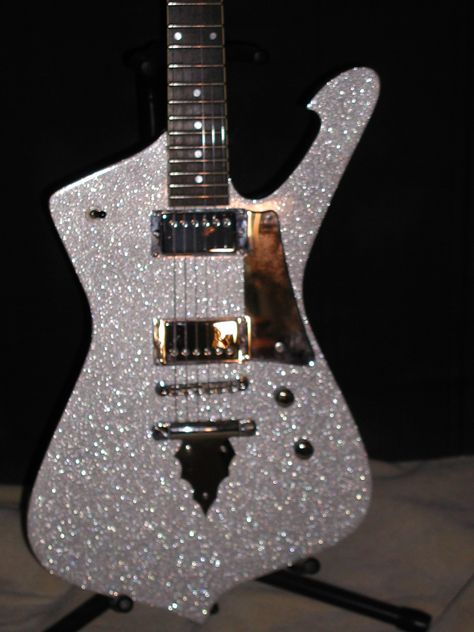 IBANEZ ICEMAN IC300 GUITAR. This was repainted in a heavy metal flake silver. Chrome humbuckers with chrome rings were installed. Then I made custom mirror accents and installed.  jA Clear Electric Guitar Aesthetic, Silver Guitar, Glittery Guitar, Iceman Guitar, Silver Electric Guitar, Clear Bass Guitar, Ibanez Guitars, Custom Electric Guitars, Guitar Obsession