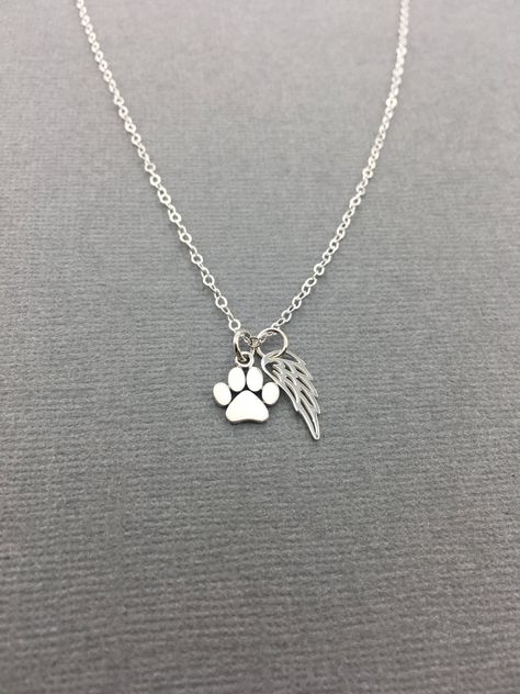 "Dainty sterling silver sympathy necklace for a friend or family member who has recently lost a furbaby! A sweet gift to keep them close to the heart even when they get their wings. [ * ITEM INFO * ] ~ Materials making this piece are: Sterling Silver ~ Select length of necklace from the drop down menu ~ Paw print charm measures: 9mm x 11mm ~ Comes wrapped in a beautiful box, perfect for gifting! See last image for picture :) * * * * * * * * * * * * * * * * * * * * [ * JEWELRY ADDITIONS * ] Make Dog Shopping, Cat Angel, Paw Jewelry, Diamond Cross Necklace Gold, Paw Print Charm, Angel Wing Necklace, Angel Jewelry, Dog Jewelry, Memory Keeping