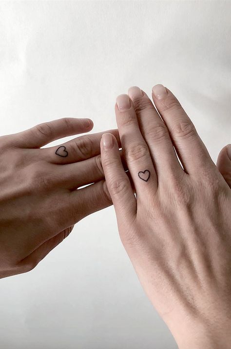 Tattoo For Couples Who Don't Need An Engagement Ring To Seal Their Love.  How do you prove your love to your significant other?   Couples marriage ring tattoos to prove your love. Marriage Ring Tattoos, Marriage Tattoos, Infinity Couple Tattoos, Wedding Band Tattoo, Heart Couple, Tattoo Wedding Rings, Ring Finger Tattoos, Marriage Ring, Matching Couple Tattoos