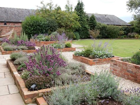 traditional brick planters Brick Garden Planters, Brick Garden Bed Raised, Brick Vegetable Garden Raised Beds, Brick Raised Planter, Red Brick Planter, Brick Veggie Garden Bed, Red Brick Garden Bed, Red Brick Raised Garden Bed, Brick Planters