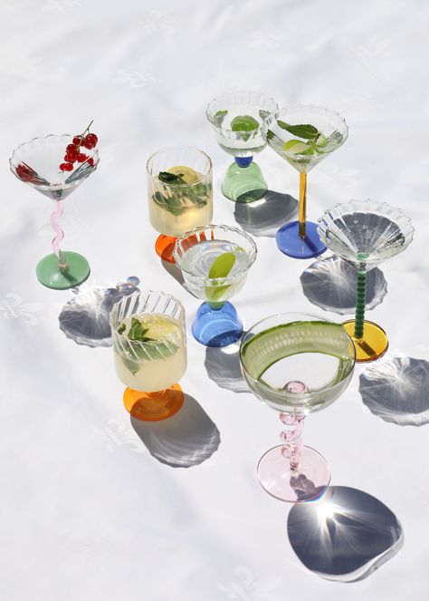 THE PRODUCT Enjoy your beverage of choice with these fun and colourful coupe cocktail glasses. These unique glasses can be used for champagne, cocktails and other drinks - as well as for ice cream and desserts. The unique base features a pearl design in a deep pink green hue sitting on a amber yellow base, offering a playful look for any occasion. Food safe: Yes, Dishwasher proof: Yes, Product capacity: 150ml, DIMENSIONS 17 x D 10 cm THE DESIGNER &klevering was founded in Amsterdam, The Netherla Vintage Cocktail Glasses Aesthetic, Retro Glass Plates, Fun Drinking Glasses, Funky Cocktail Glasses, Unique Cocktail Glasses, Glassware Photography, Champagne Cocktails, Rattan Rocking Chair, Unique Glasses