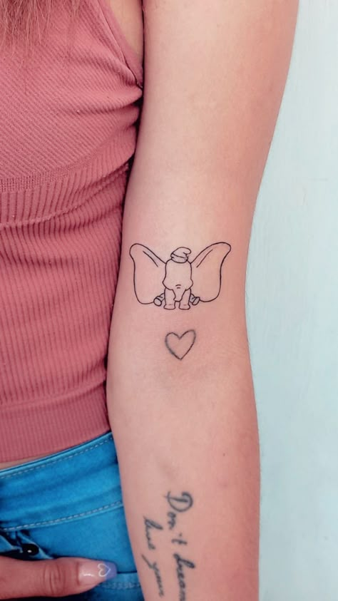 Tatuaje dumbo disney Dumbo Inspired Tattoos, Simple Dumbo Tattoo, Fine Line Cartoon Tattoo, Dumbo Outline Tattoo, Disney Tattoo Line Art, Small Dumbo Tattoo, Cute Dumbo Tattoo, Dumbo And Mom Tattoo, Little Disney Tattoos