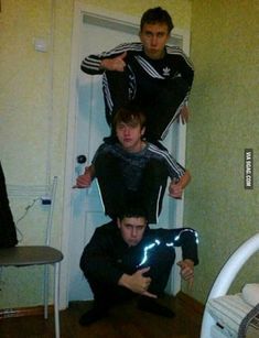 3 three british slav guys boys posing with signs stacked on top of each other meme adidas nike cursed image reaction photo