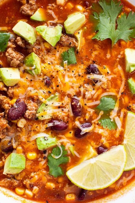 Every spoonful of this Turkey Taco Soup is brimming with flavor thanks to the ground turkey, beans, corn, and a perfectly seasoned broth. It's a hearty and filling 30-minute soup that can easily be made on the stovetop or in a slow cooker for quick weeknight dinners or lazy weekends. Serve with your favorite toppings and enjoy tons of leftovers! Ground Turkey Taco Soup, Turkey Taco Soup Recipe, Turkey Taco Soup, Ground Turkey Soup, Ground Turkey Tacos, Turkey Soup Recipe, Turkey Taco, Crock Pot Food, Soups Stews Chilis