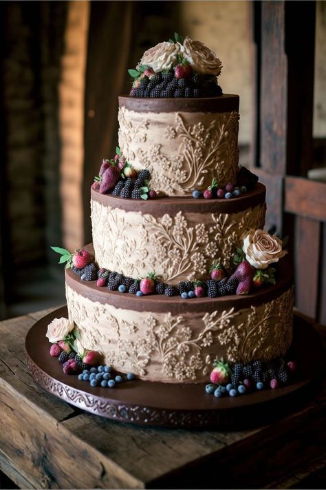 A rustic chic three-tier wedding cake with rich chocolate cake and a rustic buttercream frosting. The top tier is adorned with a scattering of fresh berries, giving it a natural and rustic look. The second and third tiers feature rough-hewn piped designs, adding to the rustic charm Piping Frosting, Cake Piping, Elegant Wedding Ideas, Rich Chocolate Cake, Three Tier, Tiered Wedding Cake, Fresh Berries, Buttercream Frosting, Rustic Chic