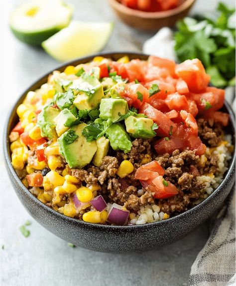 Create an easy beef burrito bowl with seasoned ground beef, rice, beans, and veggies for a quick and delicious meal. Taco Bowls Ground Beef, Beef Burrito Bowl Recipe, Beef Burrito Bowl, Burrito Bowl Recipe, Beef Burrito, Seasoned Ground Beef, Ground Beef Rice, Burrito Bowls Recipe, Beef Rice