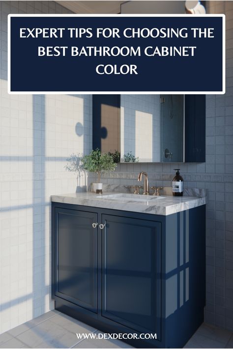 Navy blue bathroom cabinet with marble countertop and mirror in a sunlit room. Blue Paint Colors Bathroom, Color For Bathroom Cabinets, Valspar Blue Paint Colors, Paint Color Ideas For Bathroom, Best Color For Bathroom, Color Ideas For Bathroom, Color For Bathroom, Valspar Blue, Bathroom Cabinet Colors