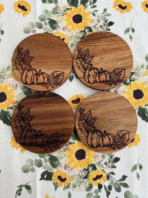 Each coaster is 4"x4" and is made from acacia wood and engraved with pumpkins and fall leaves. These are the perfect blend of decorative and functional! The listing is for a SINGLE coaster. If you are wanting a set of 4, please add 4 to your cart. PRODUCTION TIME Coasters will ship by Monday 9/12. Wood Burn Furniture, Laser Coaster Ideas, Wood Slice Coasters Diy, Small Round Wood Crafts, Wood Burned Projects, Wood Burn Art Ideas, Fall Pyrography, Woodburn Coasters, Cute Wood Burning Ideas