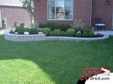 Front Yard Landscaping With Retaining Wall, Front Yard Retaining Wall Ideas, Under Window Landscaping, Landscape Bricks, Front Lawn Landscaping, Brick Garden, Small Front Yard Landscaping, Stone Landscaping, Front Garden Landscape