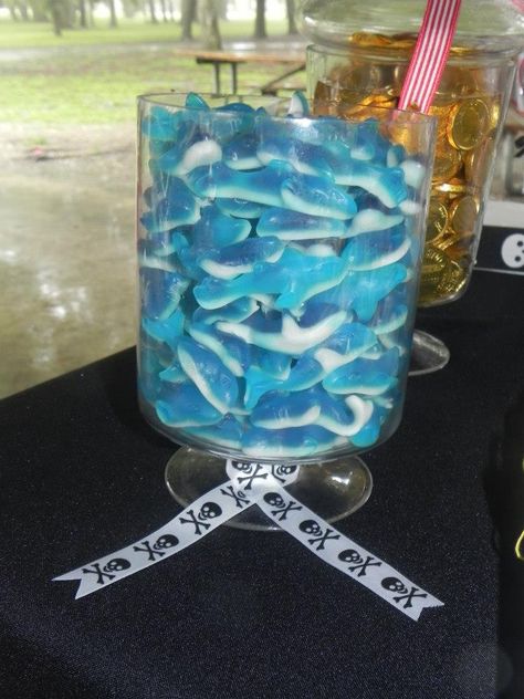 Food ideas. Pirate theme party. Gummy sharks One Piece Themed Food, 3rd Birthday Pirate Party, Pirate Beach Party, Pirate 5th Birthday Party, Pirate Themed 4th Birthday Party, Mermaid And Pirate Birthday Party Food, Gummy Sharks, Pirate Food, Pirate Themed Birthday Party