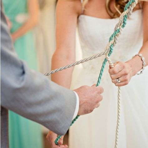 Instead of lighting the traditional unity candle during the ceremony, the couple opted to do a God's Knot, tied with the light mint green and ivory color themes of the day. The "knot" consisted of three strands, one to represent Cristin, one for Mike, and one for God - the meaning behind was that the couple ties their life in together and with God. Unity Braid, Cord Of Three Strands, Unity Ceremony, Light Mint Green, When I Get Married, Ceremony Ideas, Unity Candle, Wedding Wishes, Fairytale Wedding