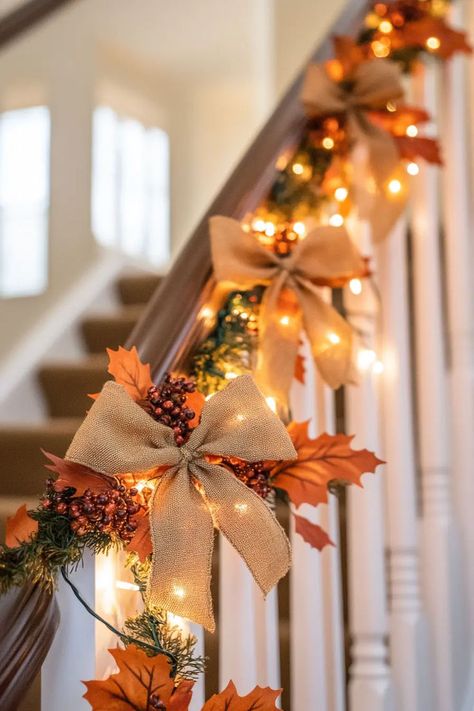 Fall staircase accented with lanterns filled with batteryoperated candles and pinecones Fall Decor Ideas For Staircase, Fall Garland For Staircase, Fall Garland Staircase, Fall Decor Staircase, Thanksgiving Staircase Decor, Fall Staircase Decor Railings, Fall Staircase Decor, Fall Staircase, Small Porch Fall Decorating Ideas