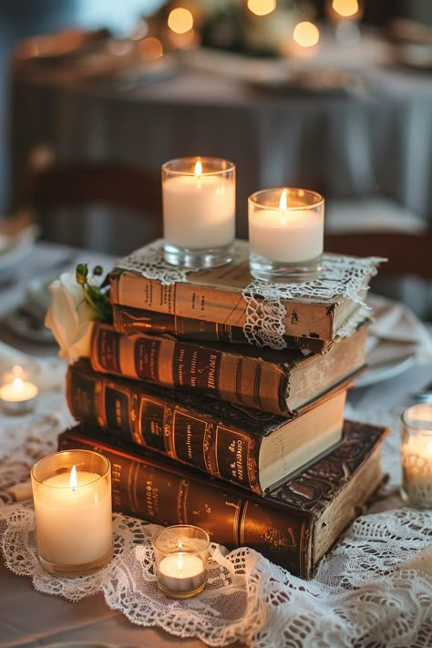 Transform your wedding tables into a storybook scene with our antique book centerpieces! 📚💒 Delicate lace runners and warm votive candles complete the romantic ambiance. Perfect for bibliophiles saying I do! #WeddingInspiration #VintageWedding #BookLover #RomanticDecor #WeddingIdeas #Candlelight #AntiqueChic #LaceDetails Let the love stories of old add charm to your special day! Old Books Wedding Decor, Whimsigoth Wedding Decor, Fae Wedding Theme, Book Centrepiece Wedding, Vintage Book Wedding, Books Wedding Decor, Literary Wedding Theme, Vintage Book Centerpiece, Book Wedding Centerpieces