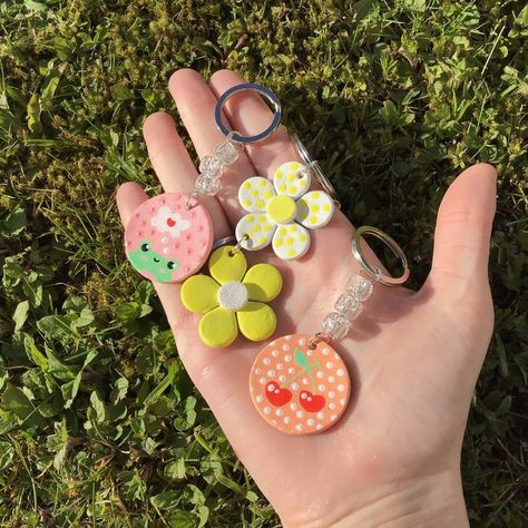 Handmade air dry clay hand painted keychains with floral, cherry and frog print designs <3 Air Dry Clay Keychain, Keychain Painting, Floral Keychain, Clay Modelling, Dundee Scotland, Frog Print, Clay Keychain, Clay Hand, Dundee