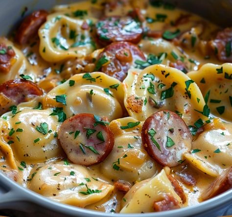 This Cheesy Kielbasa and Pierogi Skillet is a comforting and flavorful meal that brings together smoky kielbasa, tender pierogis, creamy sour cream, and melty cheddar cheese. It’s an ideal one-pan dinner that’s easy to prepare, making it perfect for busy weeknights or cozy family gatherings. The addition of sauerkraut adds a tangy twist, but it’s entirely optional based on your taste. With minimal ingredients and quick prep, this dish delivers satisfying flavors with every bite. Kielbasa And Pierogies, Crockpot Pierogi Casserole, Pierogi Casserole With Kielbasa, Ham Casseroles, Pierogies And Kielbasa, Cheesy Kielbasa, Dinner Date Recipes, Pierogi Casserole, Perogies Recipe