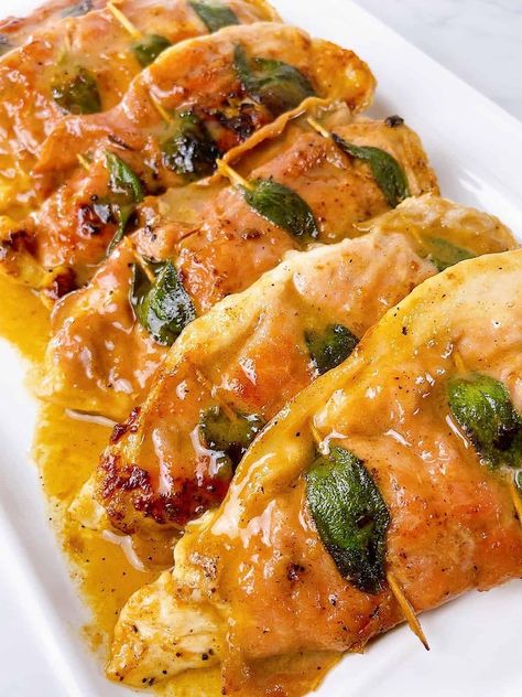 Chicken Saltimbocca on a platter with sauce Saltimbocca Chicken, Pesto Chicken Saltimbocca, Chicken Saltimbocca Recipe Giada, Stuffed Chicken With Prosciutto, Chicken Saltimbocca Mary Berg, Chicken Saltimbocca Recipe Prosciutto, Chicken Saltimbocca Food Network, Chicken Saltimbocca Recipe, Saltimbocca Recipe