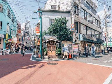 a district in japan on a sunny day with people walking in street Japanese Neighborhood, Tokyo Neighborhoods, Visit Tokyo, Furano, Tokyo Street, Neighborhood Guide, Aesthetic Japan, Siem Reap, Design Hotel