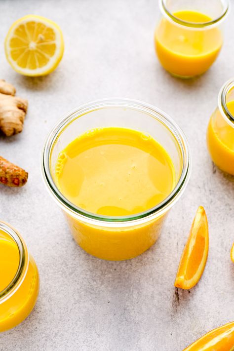 A jar of juiced ginger turmeric shots. Ginger Turmeric Shots, Ginger Shot Recipe, Turmeric Shots, Lemon Health Benefits, Health Benefits Of Ginger, Turmeric Health, Ginger Shot, Turmeric Recipes, Ginger Benefits