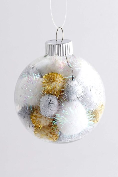 Insert gold, silver, and white pom-poms in a clear glass ball ornament for a sparkly, energetic look for your tree. This handmade ornament is ready in just minutes. #diychristmasornaments #homemadechristmasornaments #diybulbornaments #christmascrafts #bhg Clear Christmas Ornaments, Clear Glass Ornaments, Clear Ornaments, Glass Ball Ornaments, Pretty Christmas, Christmas Ornaments Homemade, Christmas Ornament Crafts, Christmas Tree Themes, Xmas Ornaments