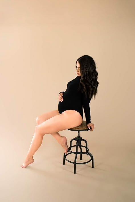 I’m Studio Maternity Shoot, Studio Maternity Photos Plus Size, White Bodysuit Maternity Photoshoot, Maternity Pictures Bodysuit, Maternity Shoot Sitting Poses, Studio Maternity Shoot Bodysuit, Moody Maternity Shoot Studio, Black Body Suit Maternity Shoot, Black Bodysuit Maternity Shoot