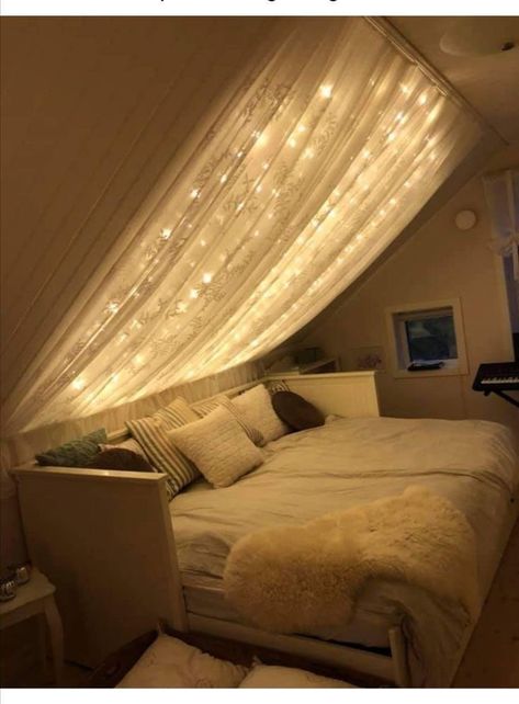 Canopy Bed Decorating Ideas Fairy Lights, Curtain Over Bed With Lights, Omega Nest, Slanted Ceiling Bedroom Ideas, Akanksha Sharma, Curtain Decor Ideas, Bathroom Curtains Ideas, Slanted Ceiling Bedroom, Bedroom Inspiration Cozy