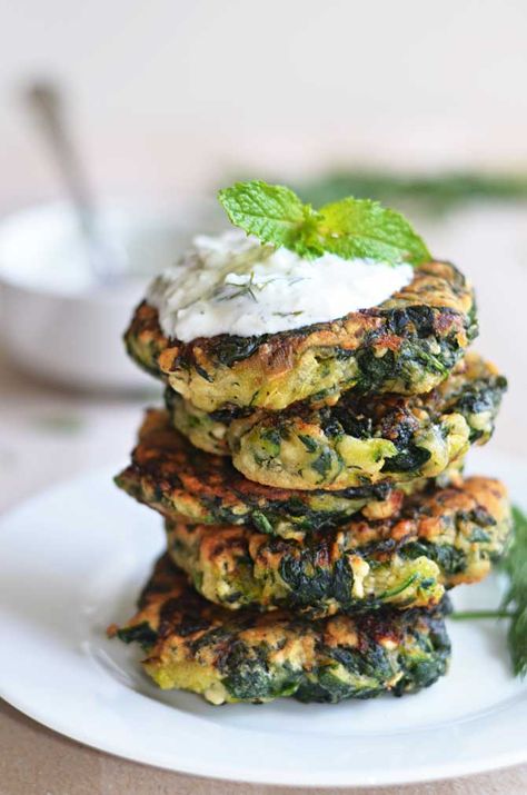 Zucchini, Feta, and Spinach Fritters with Garlic Tzatziki - Host The Toast Spinach Fritters, Tzatziki Recipe, Recipes Veggie, Crispy Oven Fried Chicken, Zucchini Feta, Zucchini Fritters, Light Snacks, Spinach And Cheese, Summer Vegetable