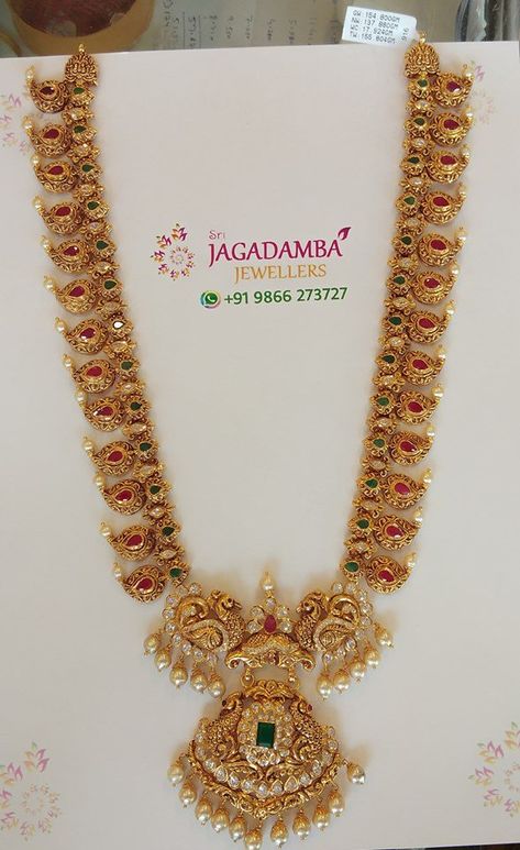 22 Carat gold antique mango haram with peacock pendant studded with rubies, emeralds, polki diamonds and pearls by Jagadamba jewellers. Desi Outfits, Mango Mala, Mala Jewelry, Haram Designs, Antique Gold Jewelry Indian, Gold Haram, Temple Jewelry, Gold Jewelry Simple Necklace, Jewelry Designing