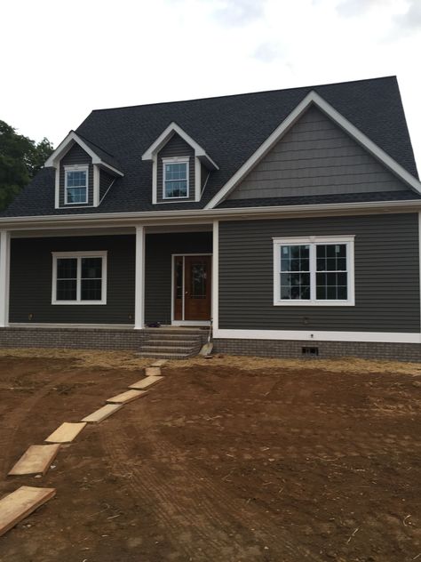 Dark Grey Bungalow Exterior, Dark Gray House Exterior White Trim, Grey House Colors, Craftsman Style Homes Exterior, Grey Siding House, Vinyl Siding Ideas, Dark Grey Siding, Gray Houses, Dark Grey Houses