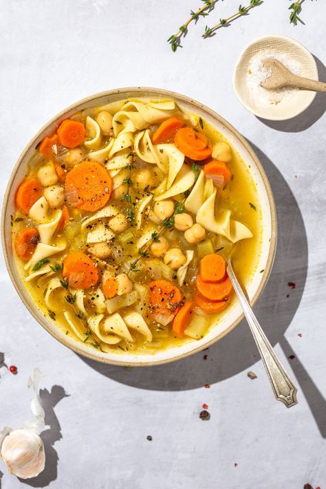 This Chickpea Noodle Soup recipe is chocked full of healthy vegetables, hearty beans, and chewy egg noodles. This soup is a great way to get more vegetables into your meal while still enjoying the comfort of delicious pasta. #soup #vegetarian #recipe Chickpea Noodle Soup, Chickpea Noodle, Soup Vegetarian, Noodle Soup Recipe, Vegetarian Soup Recipes, Delicious Pasta, Noodle Soup Recipes, Vegetarian Recipe, Vegetarian Soup