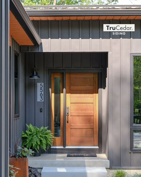 Siding Ideas Exterior Board And Batten, Black Bat And Board Siding, Metal And Wood Siding, Ironstone Siding Exterior, Board And Batten Modern Exterior, Lake House Siding Colors, Metal And Wood Siding House, Dark Grey Homes, Dark Green Metal Siding