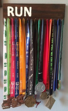 Easy DIY medal hanger to display your race medals in your home. Medal Hanger Diy, Diy Medal, Race Medal Displays, Marathon Medal Display, Running Medal Display, Medal Displays, Running Medal Holder, Race Medals, Marathon Medal