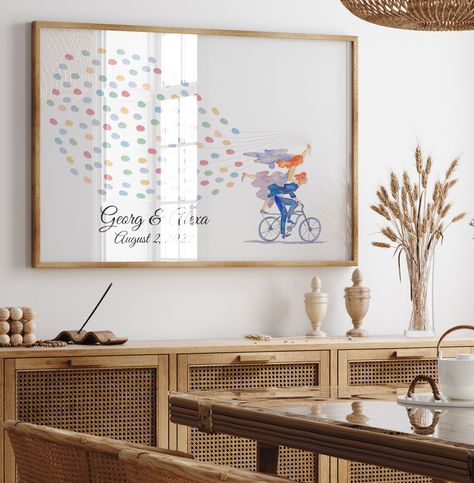 🎨🌿 Make your wedding day a canvas of memories with our Wedding Fingerprint Guestbook! This lovely piece showcases a couple on a bike, with a vibrant trail of guest fingerprints, creating a unique and heartfelt keepsake. 🚲💕 🌟 Personalize it with your wedding details 🌸 A perfect addition to your home decor 💖 Cherish the love and joy of your special day Transform your wedding memories into art. Order today! 🌟 #WeddingFingerprintGuestbook #ArtfulWeddings #PersonalizedWeddingKeepsake #UniqueWed... Couple On A Bike, Wedding Fingerprint, Fingerprint Guestbook, Into Art, Wedding Memorial, Wedding Guest Book, Guest Book, Fingerprint, Personalized Wedding