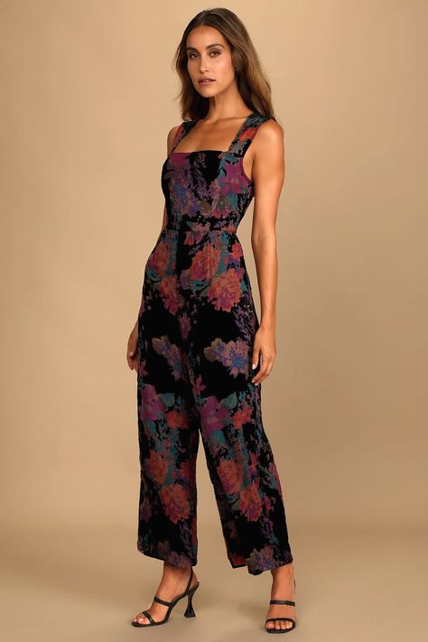 CafeMom.com : Velvet Floral Print Wide-Leg Jumpsuit : NYE Outfits That Are Both Glam & Comfy -- The flattering wide straps and square neckline on this outfit make it practical while also being a little dressy. Velvet is a thicker fabric, perfect for a cozy wintry (but glam) New Year's Eve wedding, party, or date night. And we'll say it again: jumpsuits are the ultimate in chic comfort, making this a great pick when you want the best of both worlds. Jumpsuits & Rompers, Jumpsuit Lulus, Black Halter Jumpsuit, Moody Vibes, Floral Velvet Dress, Lulu Pants, Colorful Jumpsuit, Floral Print Jumpsuit, Nye Outfits